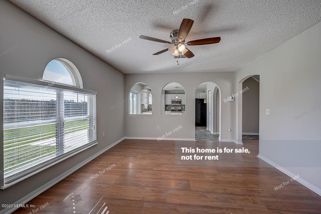 7115 High Bluff Road Jacksonville, FL 32244 - Photo 4 of 45 a view of entryway with wooden floor