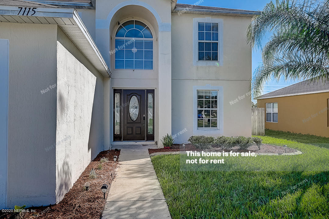 7115 High Bluff Road Jacksonville, FL 32244 - Photo 41 of 45 a front view of a house with garden