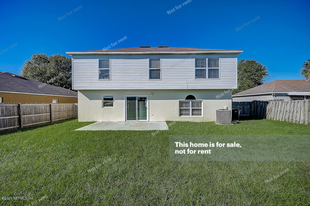 7115 High Bluff Road Jacksonville, FL 32244 - Photo 43 of 45 a view of a house with a yard