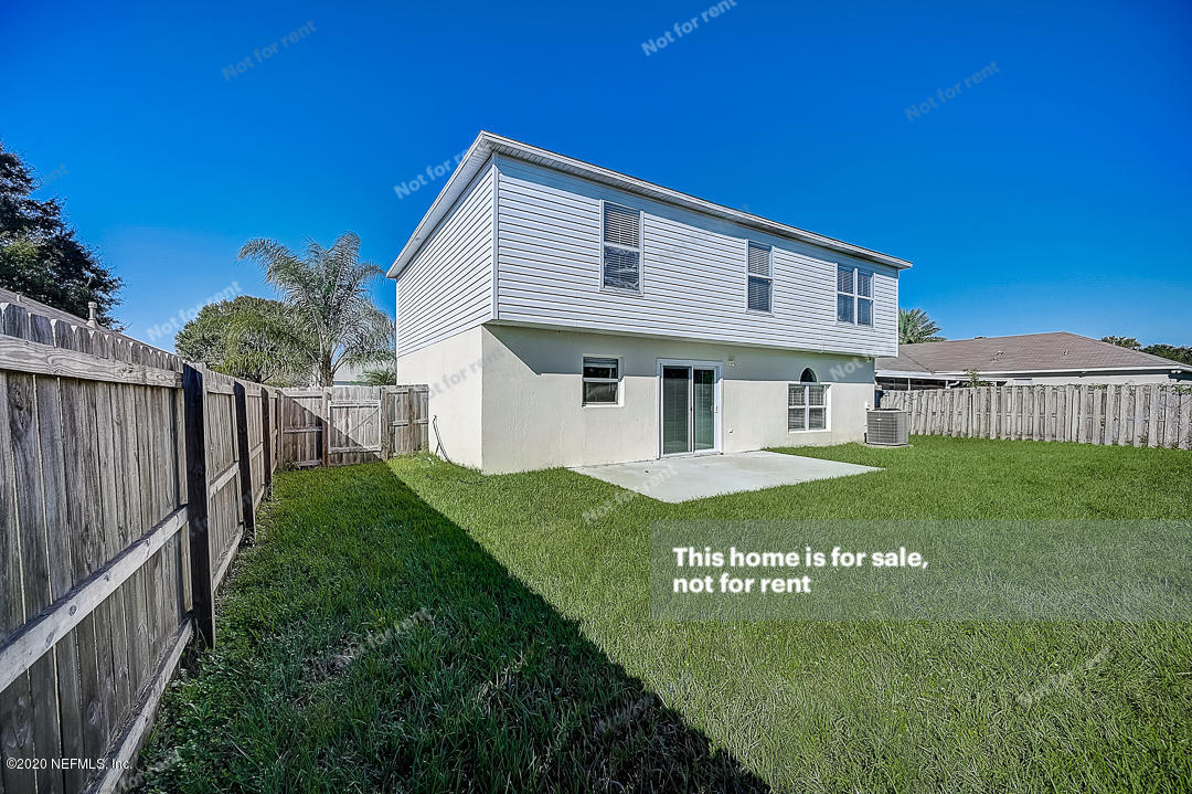 7115 High Bluff Road Jacksonville, FL 32244 - Photo 44 of 45 a view of a house with backyard and fence