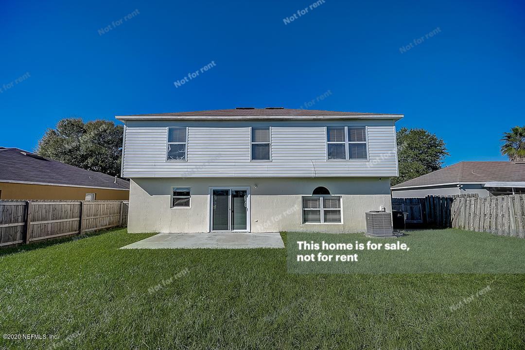 7115 High Bluff Road Jacksonville, FL 32244 - Photo 7 of 45 a view of a house with a yard