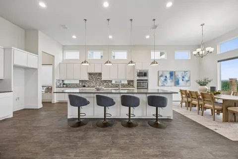 a large kitchen with kitchen island lots of counter top space