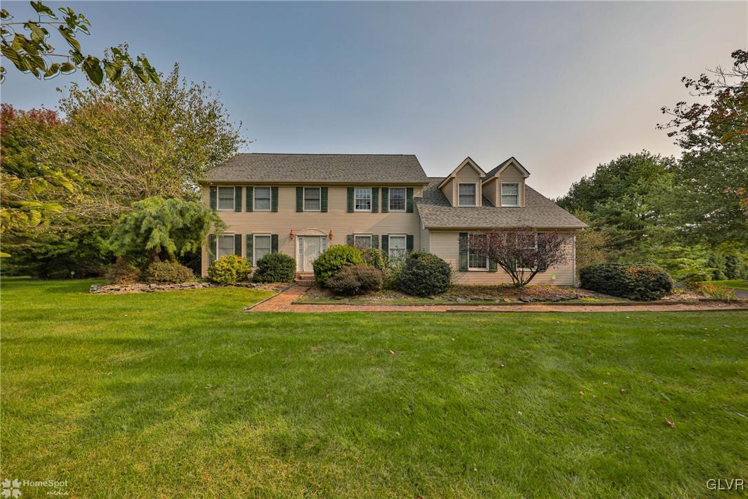 517 Roberts Road Nazareth, PA 18064 - Photo 2 of 50 a front view of a house with a garden