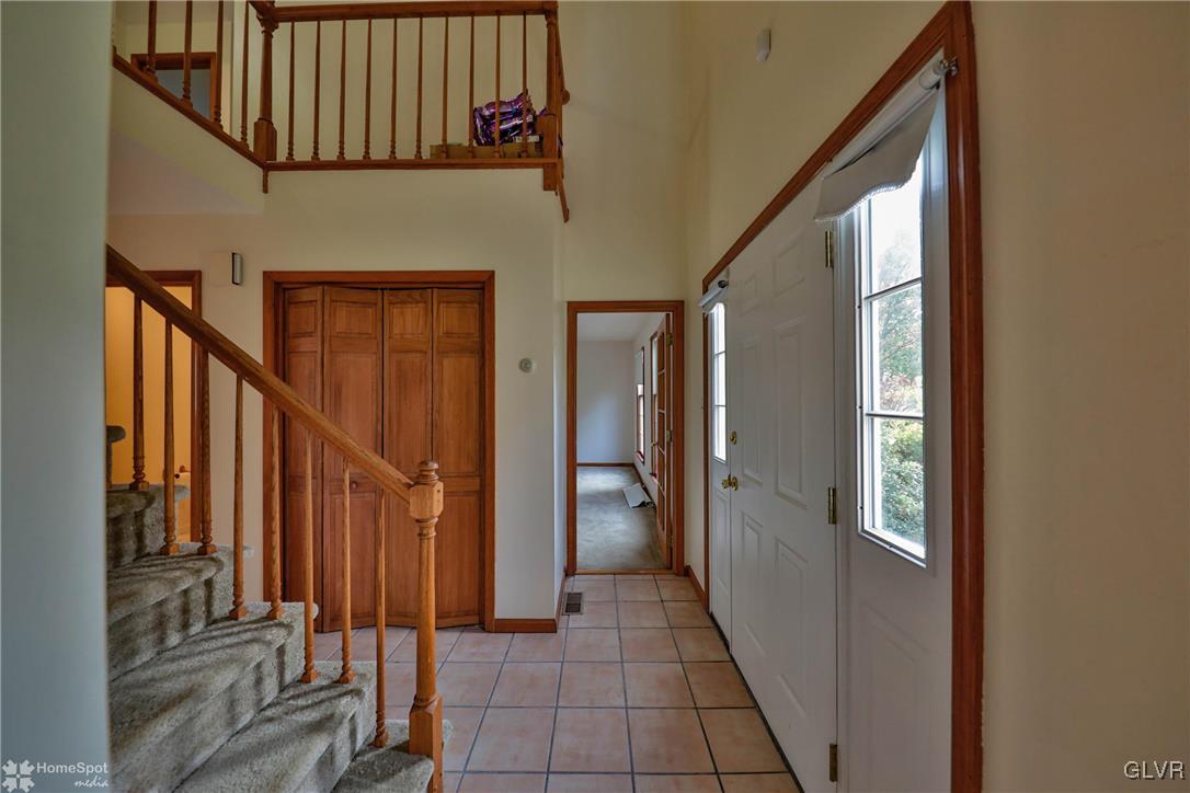 517 Roberts Road Nazareth, PA 18064 - Photo 21 of 50 a view of a hallway with wooden floor and staircase