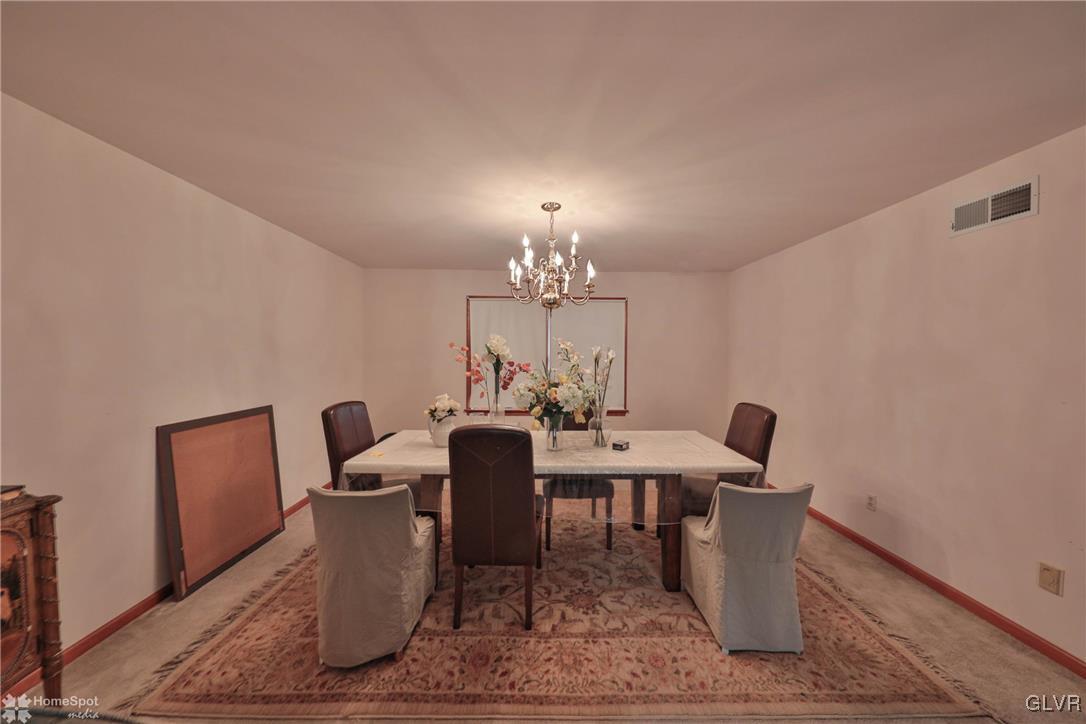 517 Roberts Road Nazareth, PA 18064 - Photo 26 of 50 a view of a dining room with furniture and a chandelier