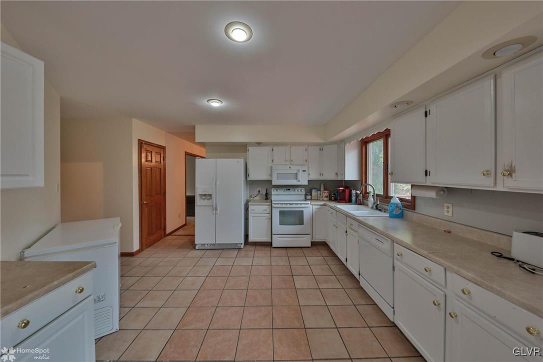 517 Roberts Road Nazareth, PA 18064 - Photo 30 of 50 a large kitchen with a stove a sink dishwasher and a refrigerator