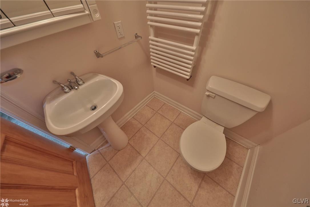 517 Roberts Road Nazareth, PA 18064 - Photo 36 of 50 a bathroom with a sink mirror and toilet