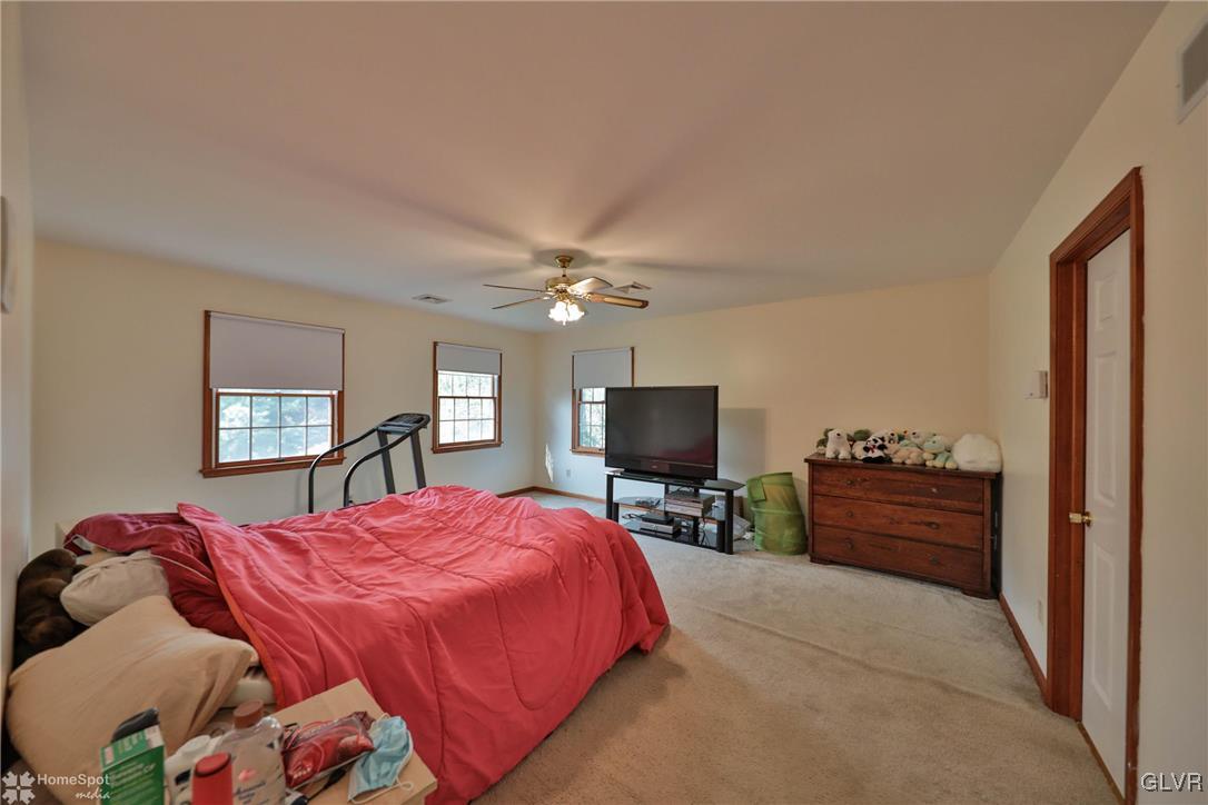 517 Roberts Road Nazareth, PA 18064 - Photo 40 of 50 a bedroom with a bed and a flat screen tv