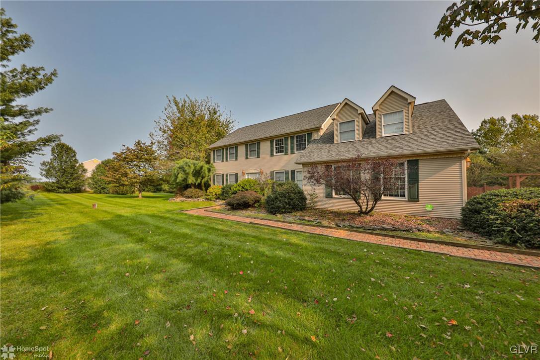 517 Roberts Road Nazareth, PA 18064 - Photo 4 of 50 a front view of a house with a garden and yard