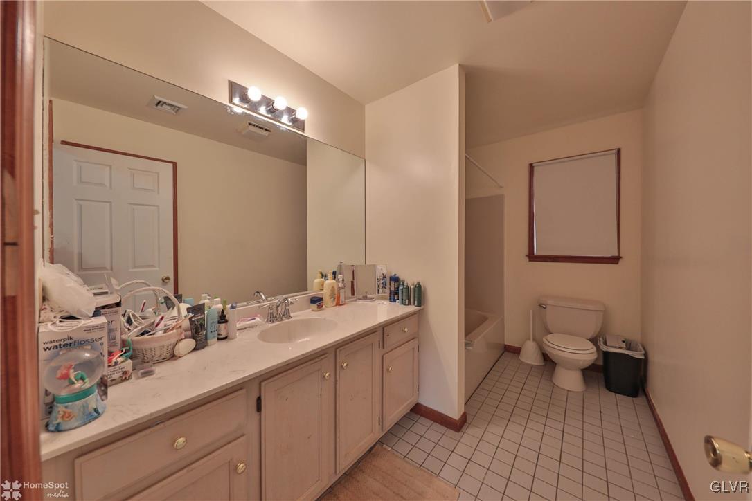 517 Roberts Road Nazareth, PA 18064 - Photo 44 of 50 a bathroom with a double vanity sink and a mirror