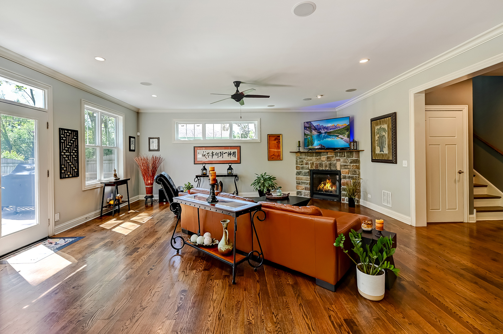 5607 Hillcrest Road Downers Grove, IL 60516 - Photo 13 of 50 a living room with furniture a wooden floor and a fireplace