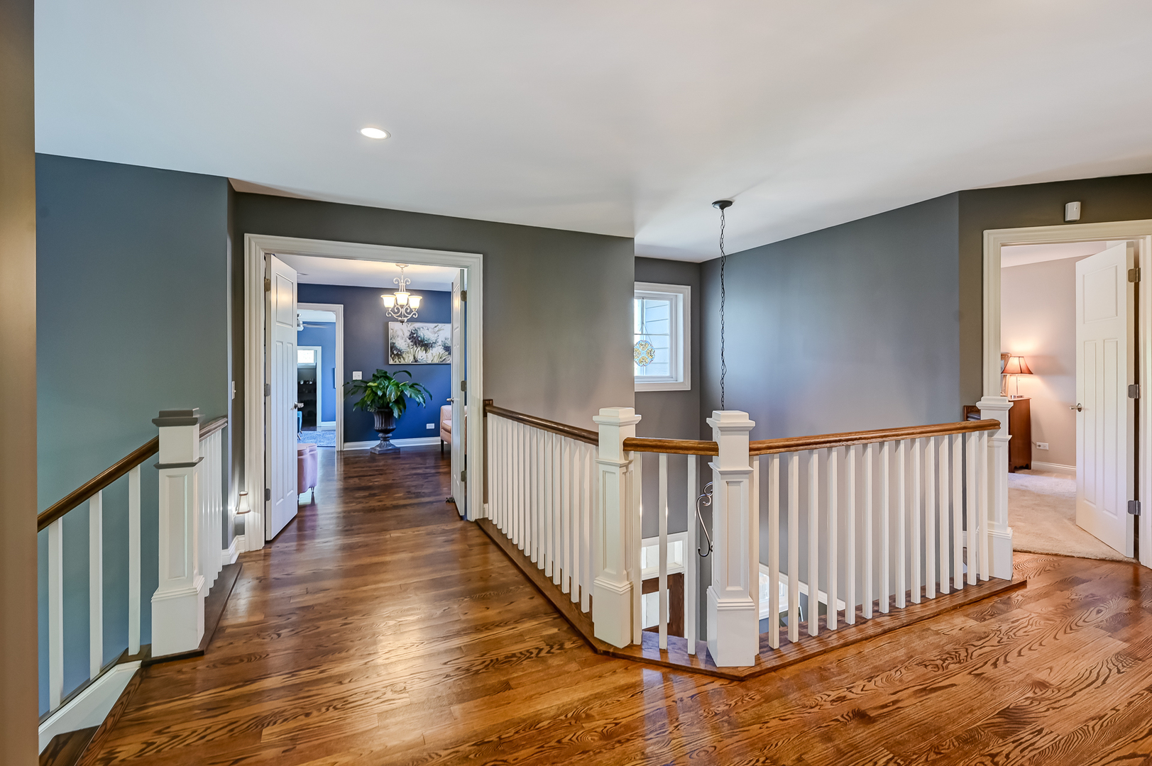 5607 Hillcrest Road Downers Grove, IL 60516 - Photo 19 of 50 a view of a hallway with wooden floor and windows