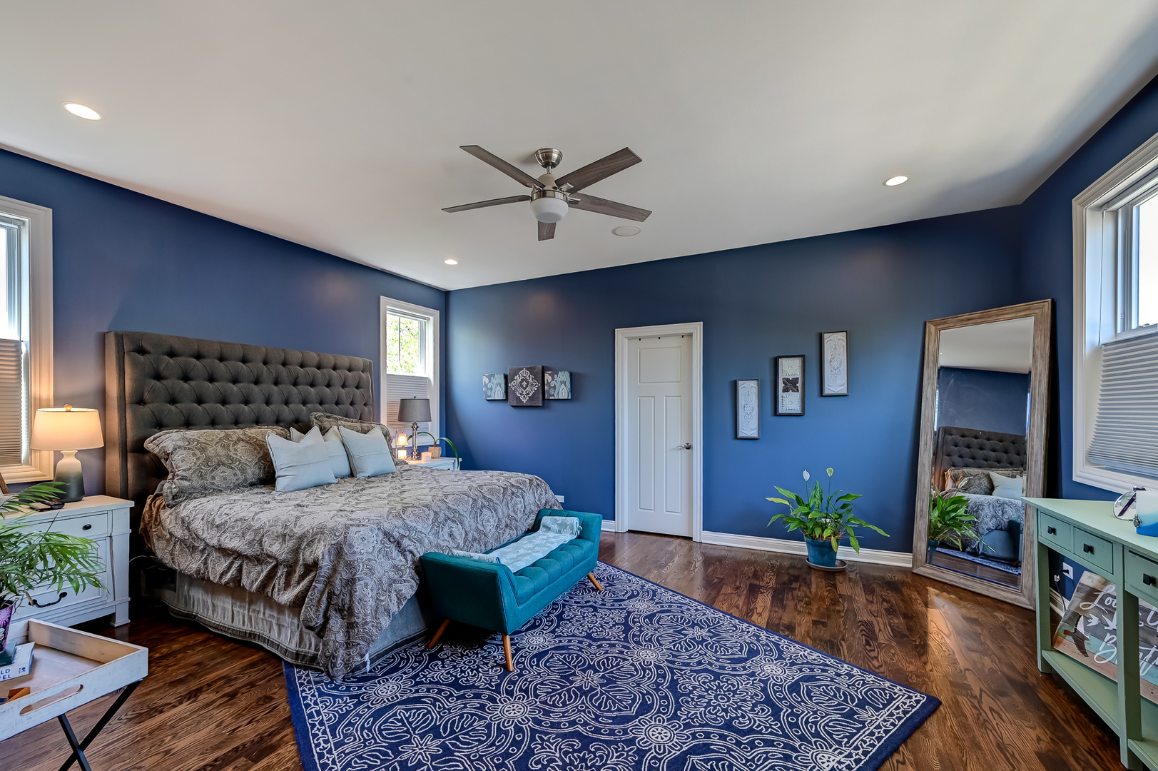 5607 Hillcrest Road Downers Grove, IL 60516 - Photo 22 of 50 a bedroom with a bed a dresser and paintings on the wall