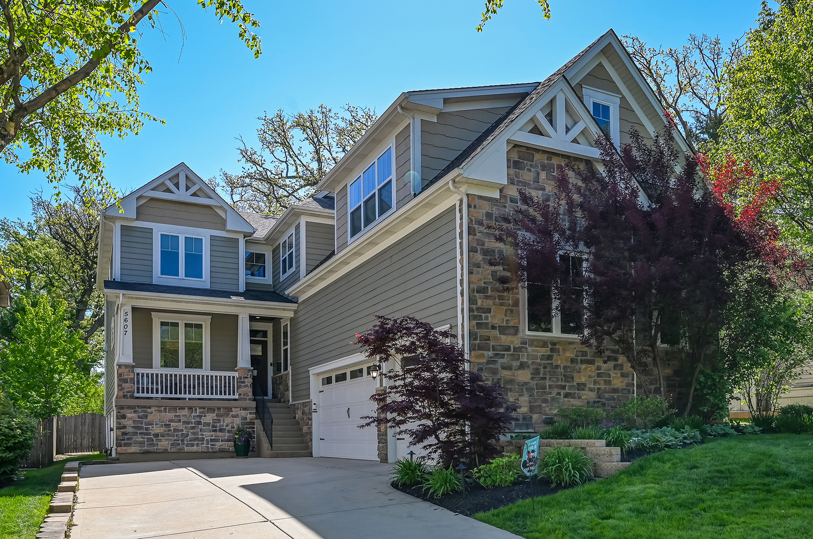 5607 Hillcrest Road Downers Grove, IL 60516 - Photo 3 of 50 a front view of a house with garden