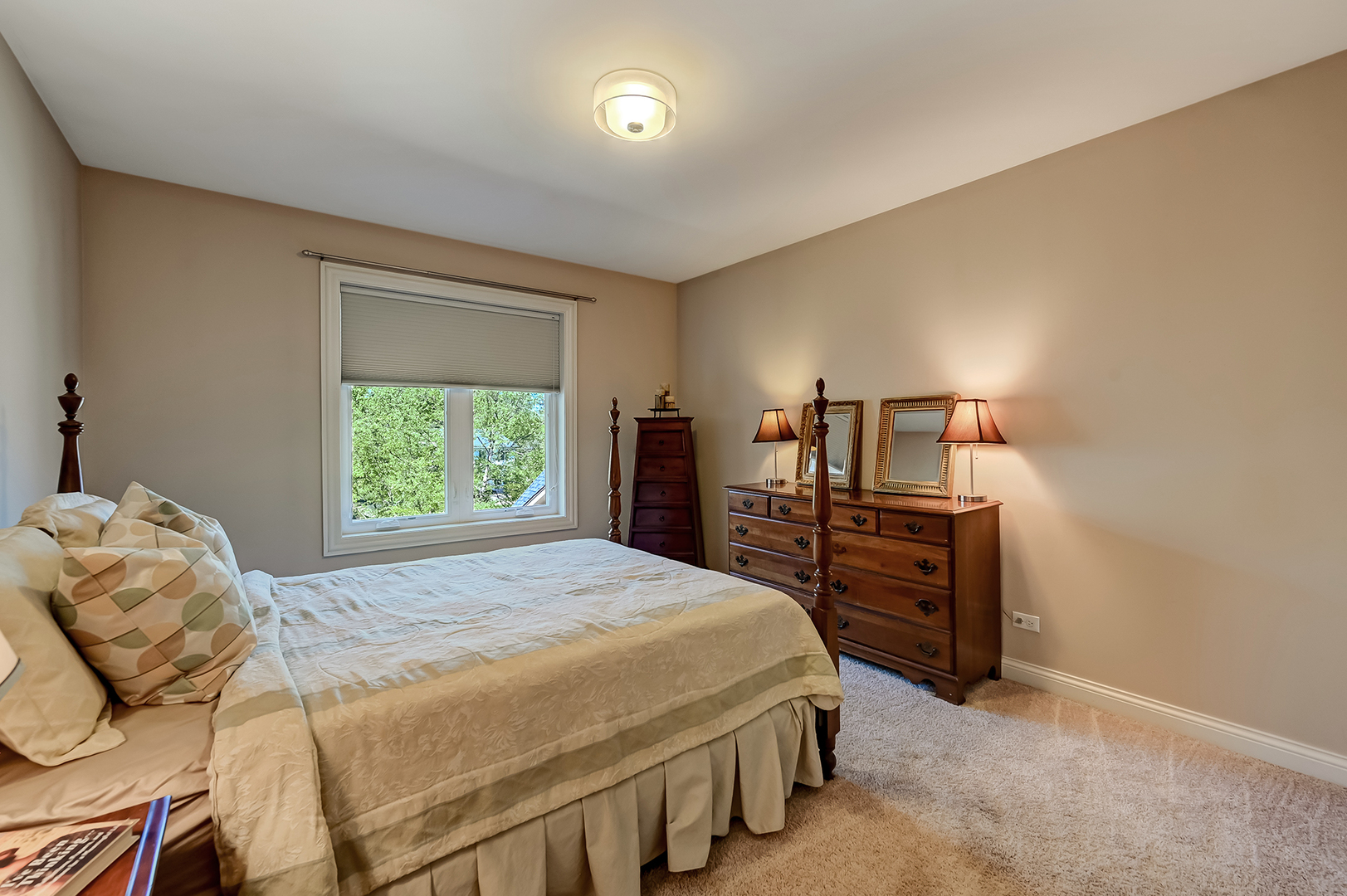 5607 Hillcrest Road Downers Grove, IL 60516 - Photo 31 of 50 a bedroom with a bed and dresser with mirror