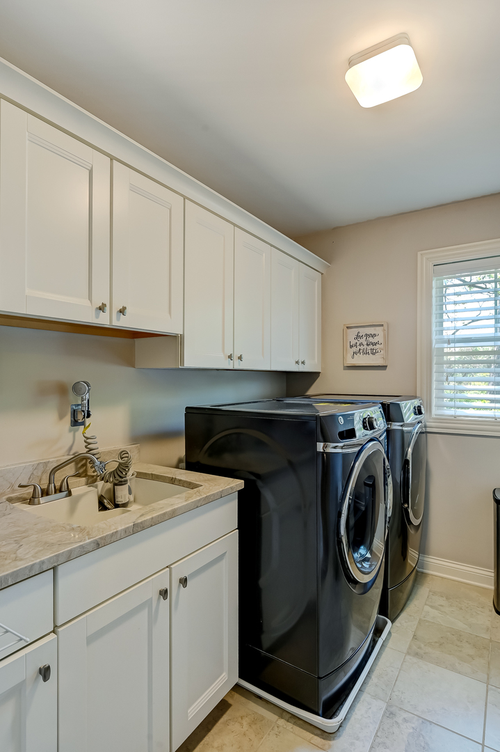 5607 Hillcrest Road Downers Grove, IL 60516 - Photo 32 of 50 a utility room with sink dryer and washer