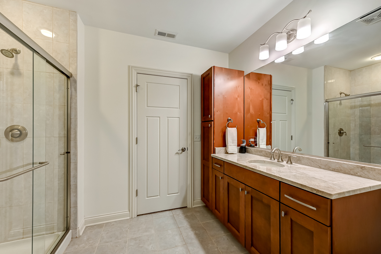 5607 Hillcrest Road Downers Grove, IL 60516 - Photo 37 of 50 a bathroom with a double vanity sink and a mirror