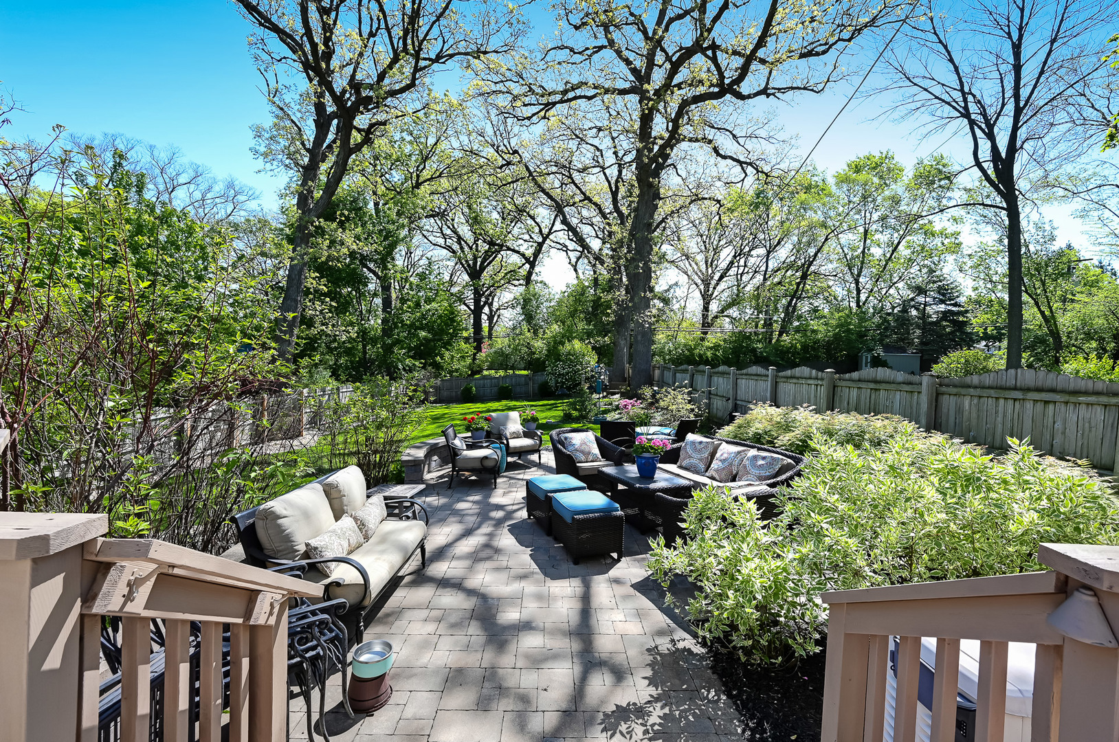 5607 Hillcrest Road Downers Grove, IL 60516 - Photo 40 of 50 a view of a patio with couches table and chairs and potted plants