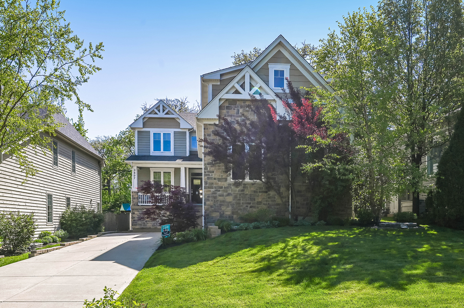 5607 Hillcrest Road Downers Grove, IL 60516 - Photo 5 of 50 a front view of a house with a garden