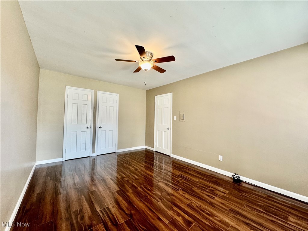 13805 Cedar Road, Unit 103C Cleveland, OH 44118 - Photo 12 of 18 Bedroom with ceiling fan and dark wood-style floors