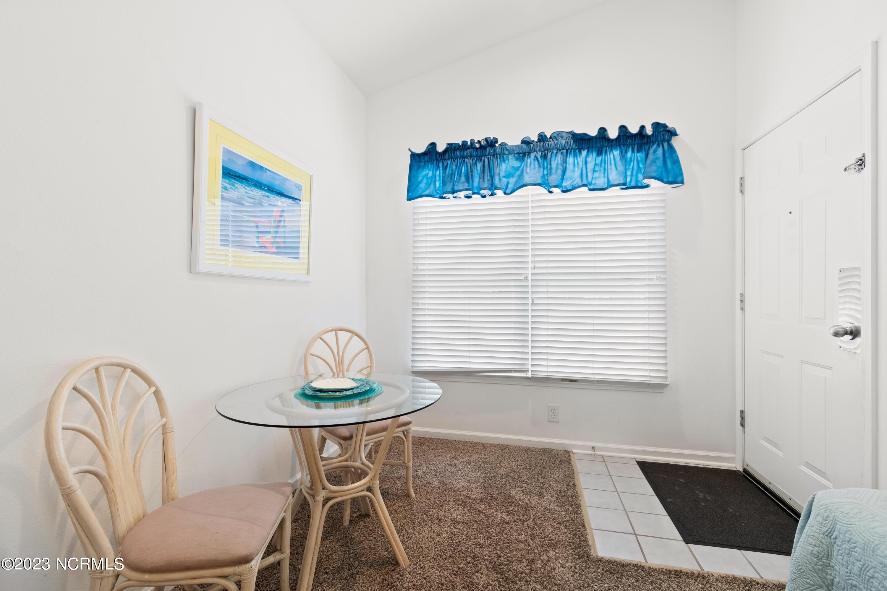 226 Clubhouse Road, Unit 17D Sunset Beach, NC 28468 - Photo 6 of 37 En suite dinning will come in handy before a long day on the beach or by the pool.