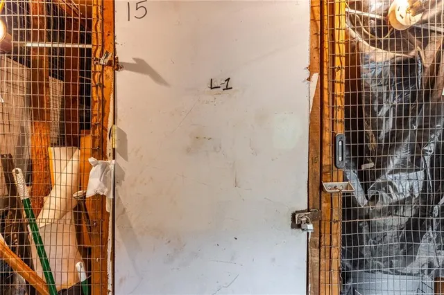 a view of a hallway with wooden stairs