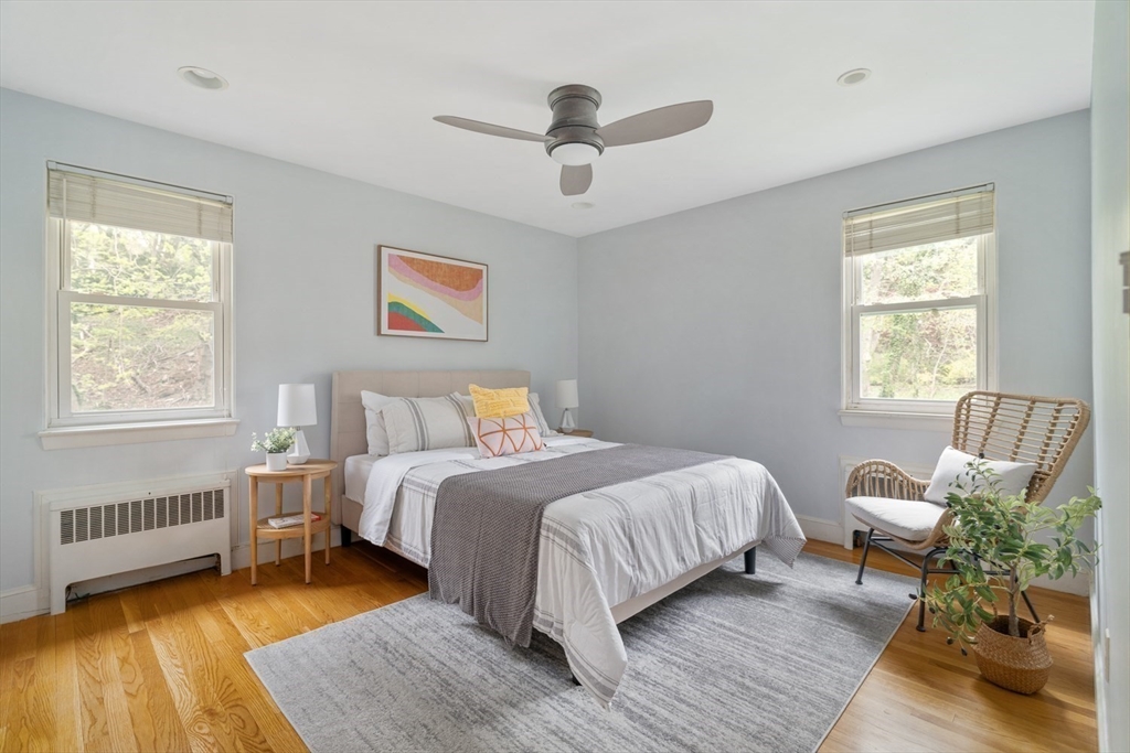22 Rambler Road Boston, MA 02130 - Photo 14 of 28 a bedroom with a bed and wooden floor