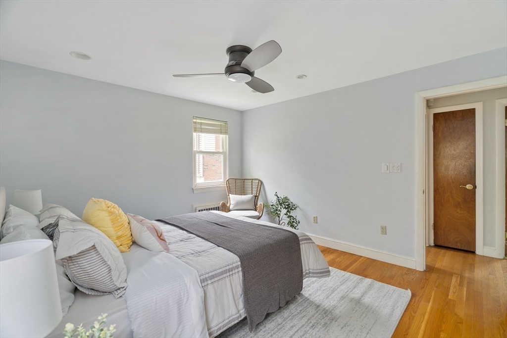 22 Rambler Road Boston, MA 02130 - Photo 15 of 28 a bedroom with a bed and wooden floor