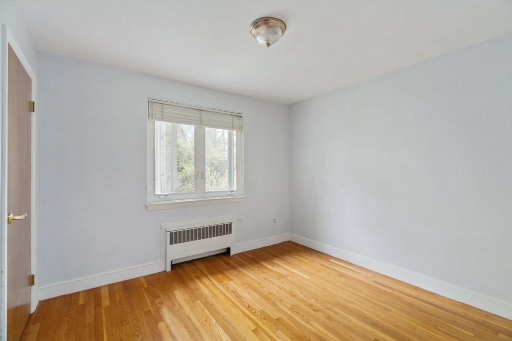 22 Rambler Road Boston, MA 02130 - Photo 16 of 28 an empty room with wooden floor and windows