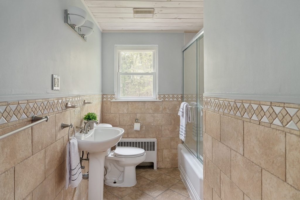 22 Rambler Road Boston, MA 02130 - Photo 18 of 28 a bathroom with a sink a toilet and tub