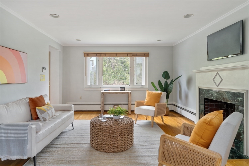 22 Rambler Road Boston, MA 02130 - Photo 2 of 28 a living room with furniture fireplace and window