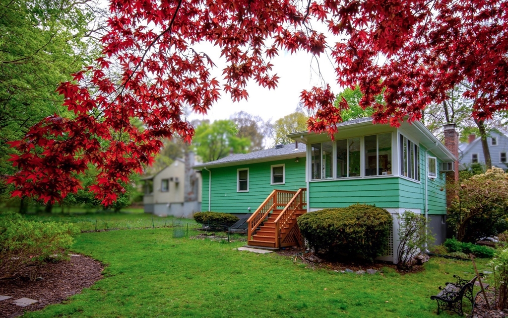 22 Rambler Road Boston, MA 02130 - Photo 23 of 28 a front view of a house with a garden and trees