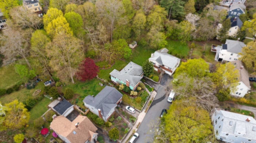 22 Rambler Road Boston, MA 02130 - Photo 24 of 28 an aerial view of a house with swimming pool and lawn chairs