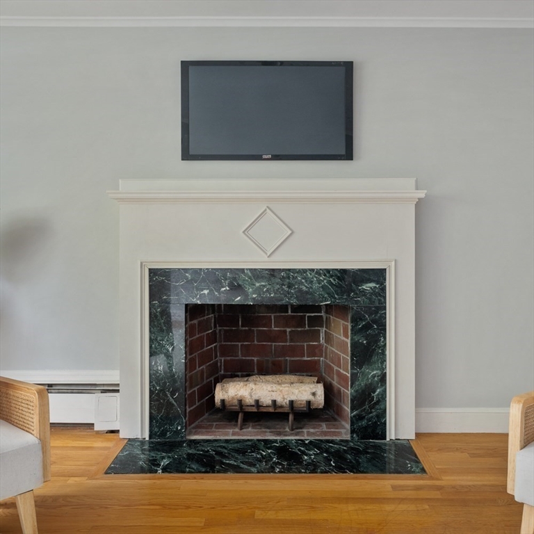 22 Rambler Road Boston, MA 02130 - Photo 6 of 28 a living room with a fireplace
