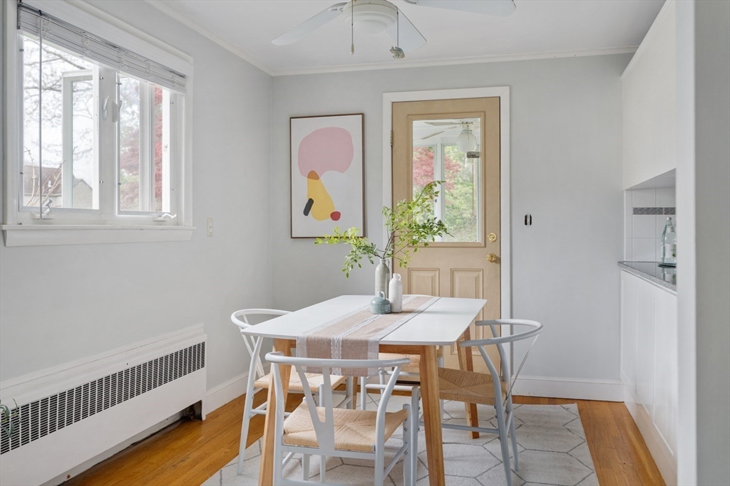 22 Rambler Road Boston, MA 02130 - Photo 8 of 28 a view of a dining room with furniture a chandelier and wooden floor