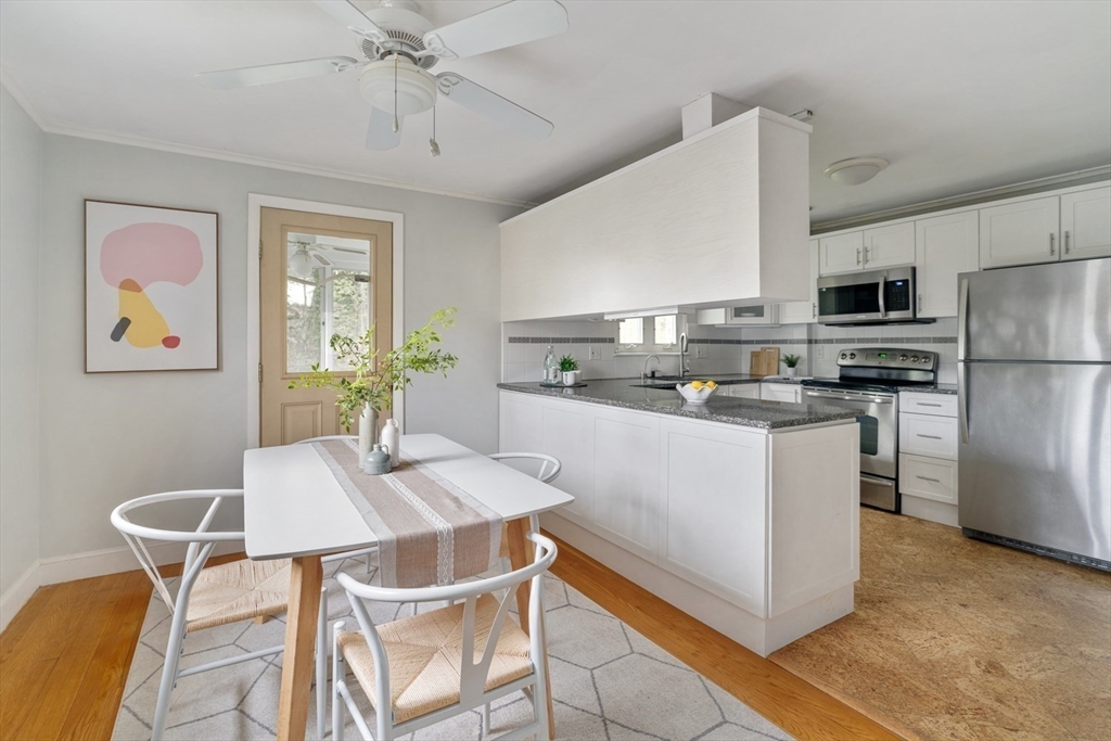 22 Rambler Road Boston, MA 02130 - Photo 10 of 28 a kitchen with stainless steel appliances a table and chairs