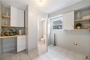a view of cabinets and window