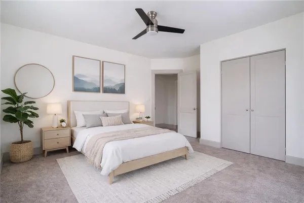a view of an empty room and a ceiling fan