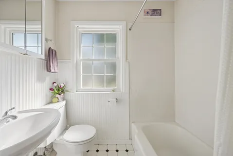 a bedroom with double bed and a fireplace