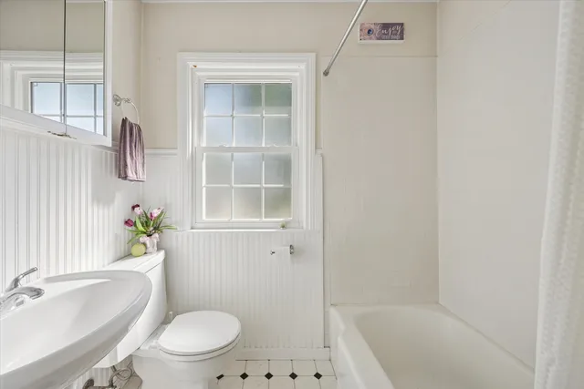 a bedroom with double bed and a fireplace