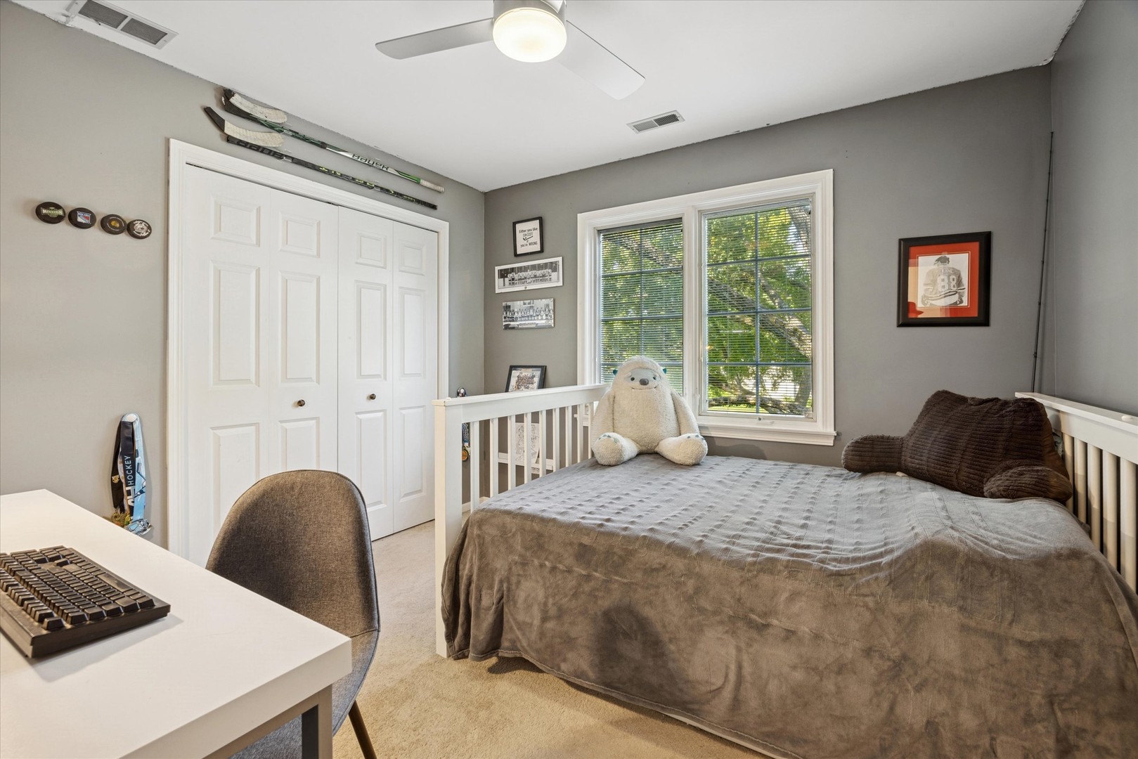 1115 North Main Street Wheaton, IL 60187 - Photo 17 of 27 a bedroom with a bed and a table