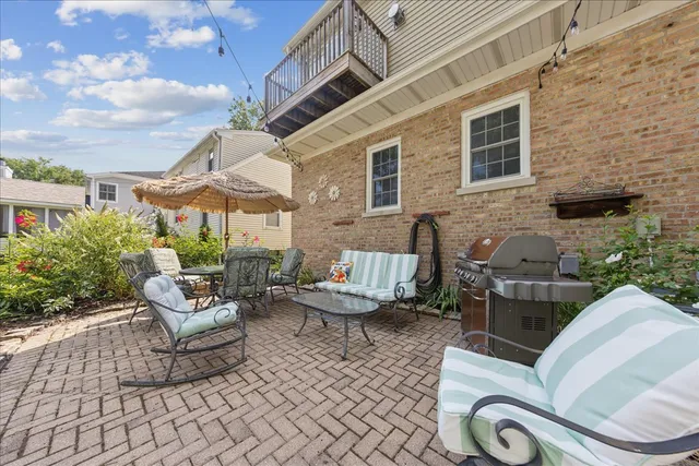 a view of a house with a backyard and garden