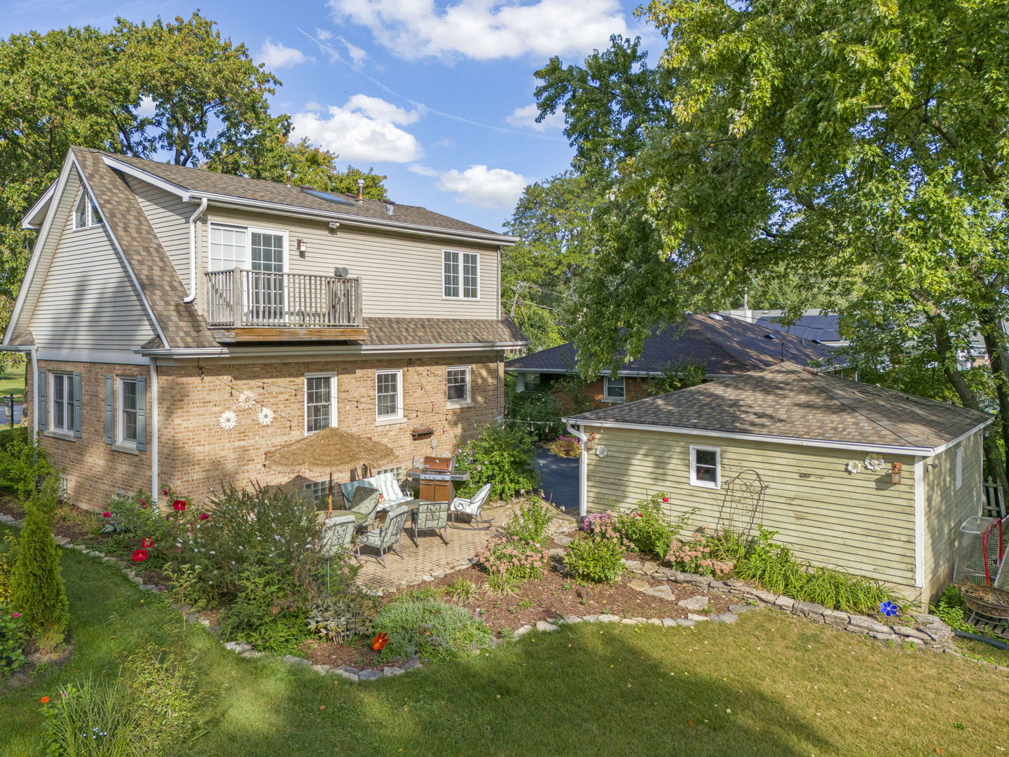 1115 North Main Street Wheaton, IL 60187 - Photo 25 of 27 a front view of a house with a yard and garage