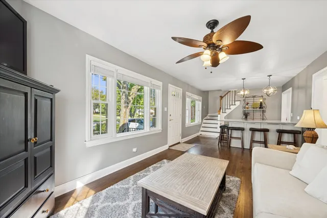 a workspace with wooden floor and a window