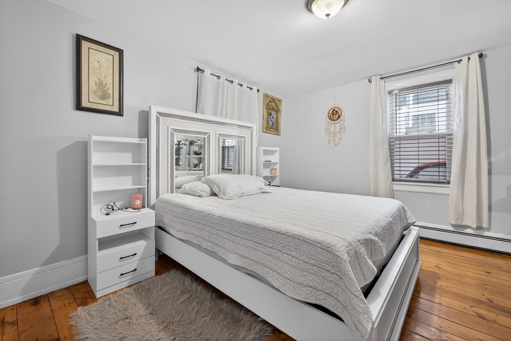 6 Morris Street Lynn, MA 01905 - Photo 11 of 36 a bedroom with a bed and a window