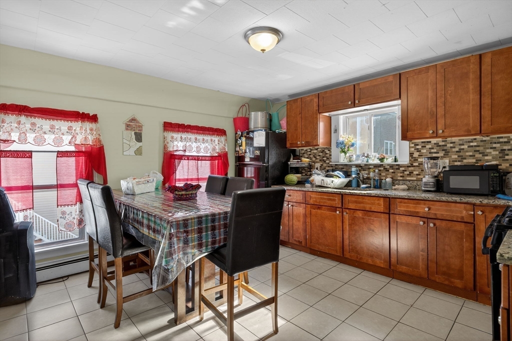 6 Morris Street Lynn, MA 01905 - Photo 19 of 36 a view of a dining room with furniture and chandelier
