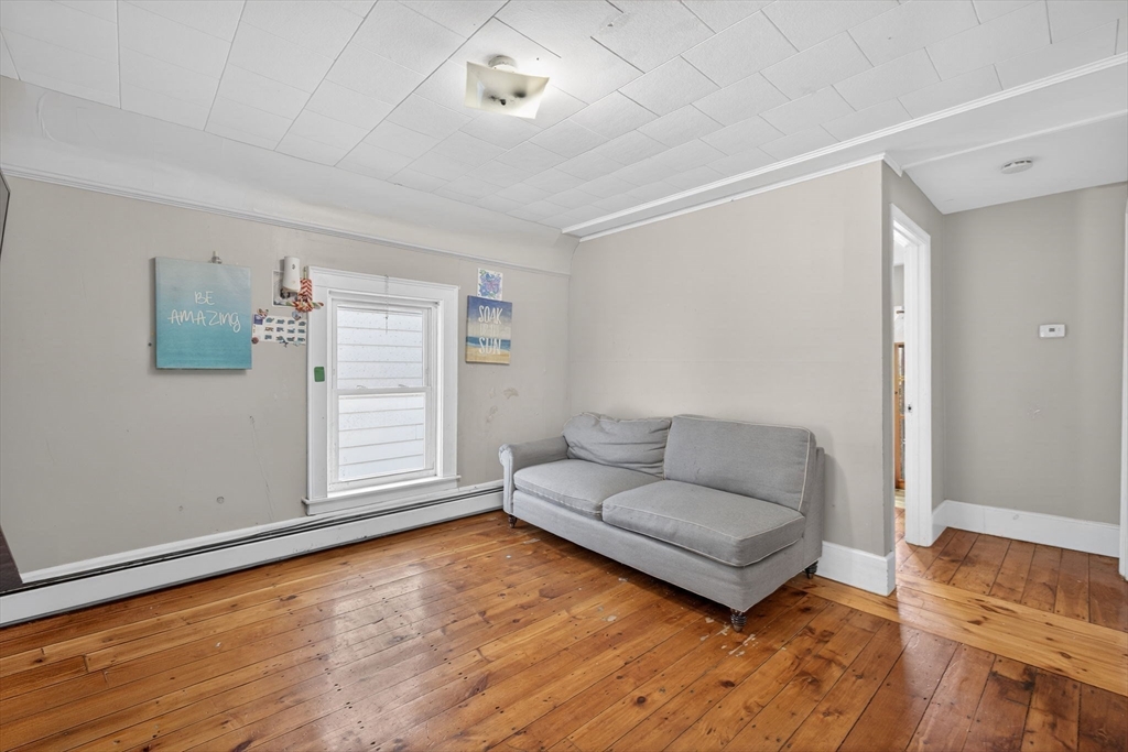 6 Morris Street Lynn, MA 01905 - Photo 20 of 36 a living room with furniture and a wooden floor