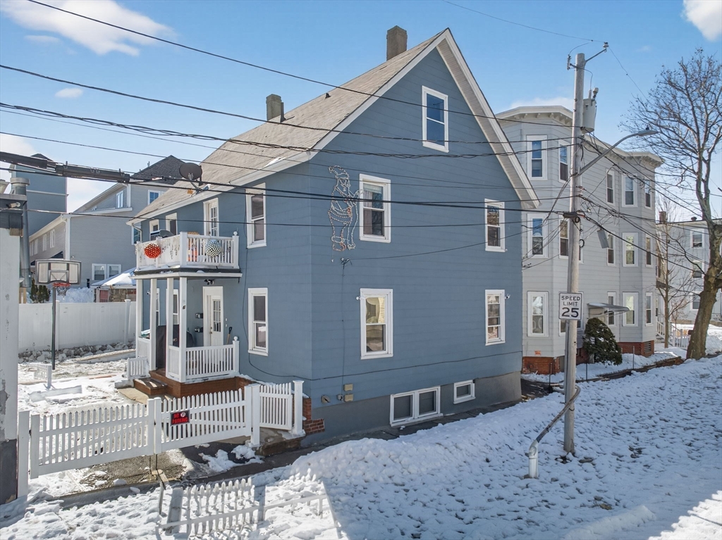 6 Morris Street Lynn, MA 01905 - Photo 2 of 36 a view of a brick house with many windows