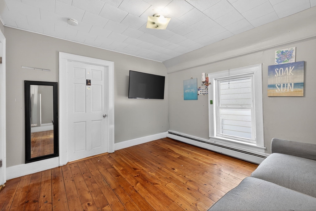 6 Morris Street Lynn, MA 01905 - Photo 21 of 36 a bedroom with a bed and a window