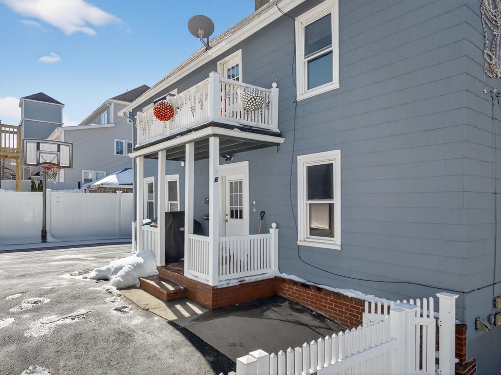 6 Morris Street Lynn, MA 01905 - Photo 3 of 36 a front view of a house with a porch